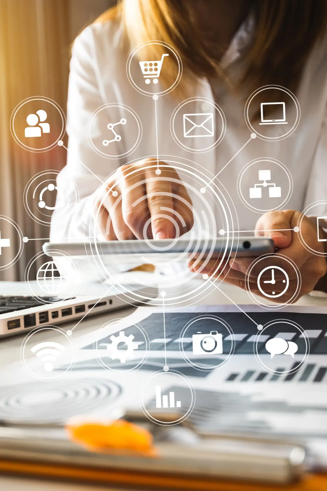 lady pressing on a tablet with digital marketing icons coming out of the device